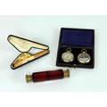 A cased pair Barometer & Compass; a crimson cutglass double ended Scent Bottle; and a carved Meersch... 