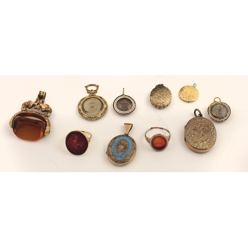 73 - A large embossed swivel Seal, two gold Gents Rings with inset stones, one with a family crest, the o... 