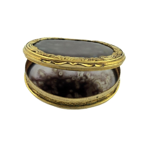 74 - An extremely fine early 19th Century gold and agate? Snuff Box, with elaborately engraved rims decor... 