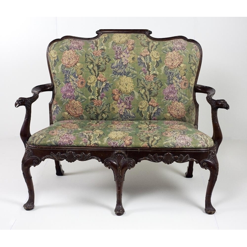 763 - An 18th Century Irish style mahogany two seater Settee, with shaped and scroll back, with S scroll a... 