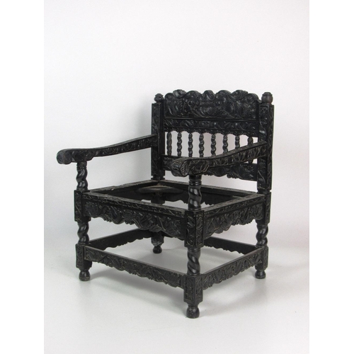 777 - An important 18th Century Indo-Dutch ebony Armchair, of small scale with elaborately carved overall ... 