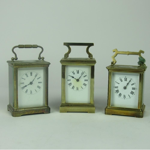 92 - Three similar 19th Century brass French and English brass Carriage Clocks, each with white enamel di... 