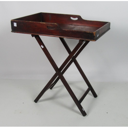 1007 - An early Victorian mahogany Butlers Tray, and original folding stand. (1)