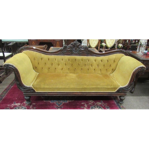 1010 - A William IV carved mahogany Settee, the shaped and carved back over a deep buttoned mustard coloure... 