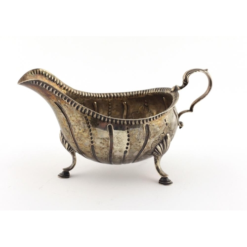 42 - A good 18th Century early George III period Irish silver Sauceboat, with beaded rim and reeded body,... 