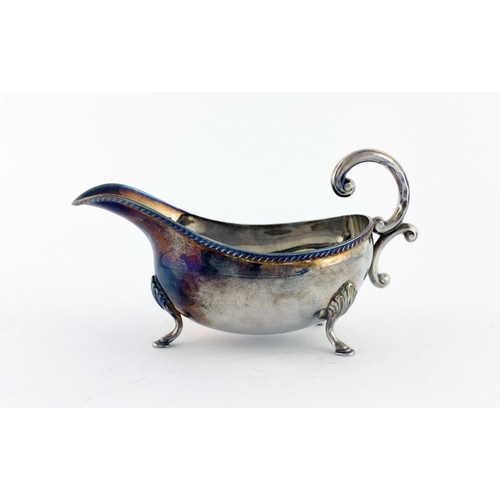 44 - An elegant silver Cream Jug, Chester c. 1907; a modern English silver Sauceboat, Birmingham c. 1972,... 