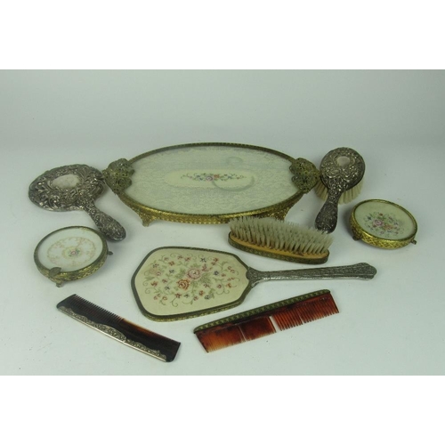 61 - A three piece silver mounted Dressing Table Set, to include mirror, brush and comb; together with a ... 