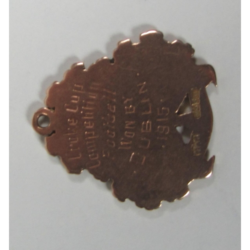 651 - Croke Cup Competition, 1915Medal: G.A.A., Football 1915, an attractive 9ct gold Medal, the obverse d... 