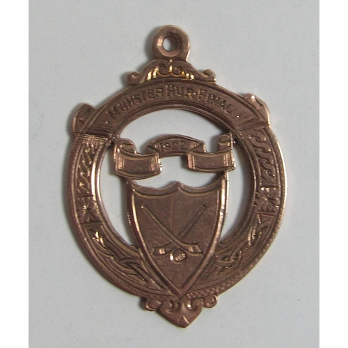 654 - Munster Hurling Final, 1922Medal: G.A.A., Tipperary, a circular and pierced 9ct gold Medal, the obve... 