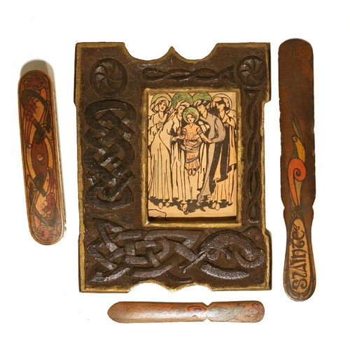 1143 - Cuala Industries: Attractive group of three wooden items, a brush and two letter-openers, each decor... 