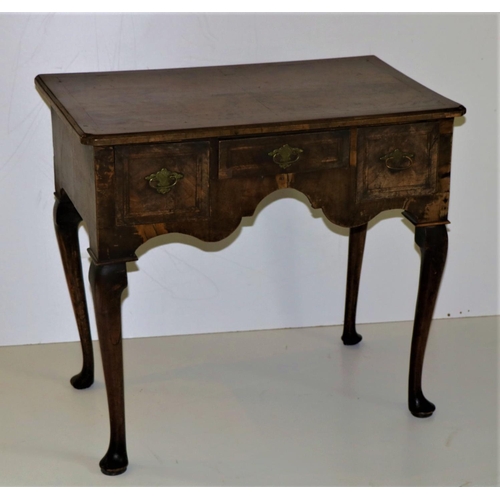 116 - An early 18th Century walnut Lowboy, the segmented figured top with herringbone crossbanded and re-e... 
