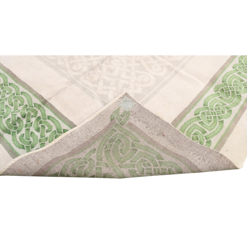 142 - A fine hand-tufted Donegal Carpet, the beige ground with a large attractive Celtic designed border o... 