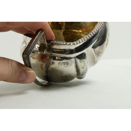 180 - A three piece silver Tea Service, Chester c. 1900, comprising ogee shaped teapot with gadroon edge o... 