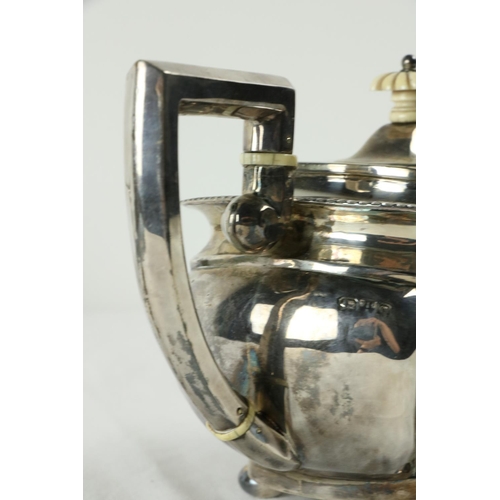 180 - A three piece silver Tea Service, Chester c. 1900, comprising ogee shaped teapot with gadroon edge o... 