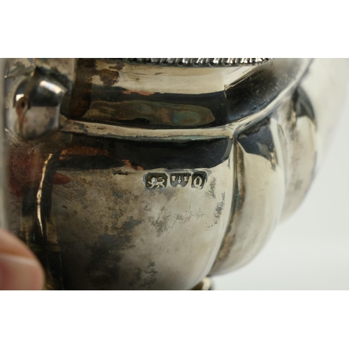 180 - A three piece silver Tea Service, Chester c. 1900, comprising ogee shaped teapot with gadroon edge o... 