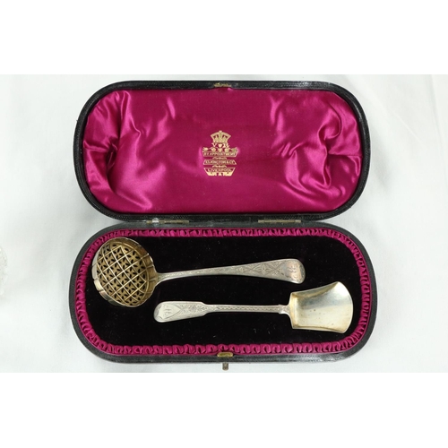 186 - A cased Victorian silver Sugar Sifter Ladle, London 1848 & a bright cut Caddy Shovel both cased ... 