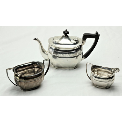 189 - A three piece silver bright cut Bachelors Tea Service, Sheffield 1900 / 1902, comprising oval teapot... 