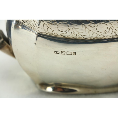 189 - A three piece silver bright cut Bachelors Tea Service, Sheffield 1900 / 1902, comprising oval teapot... 