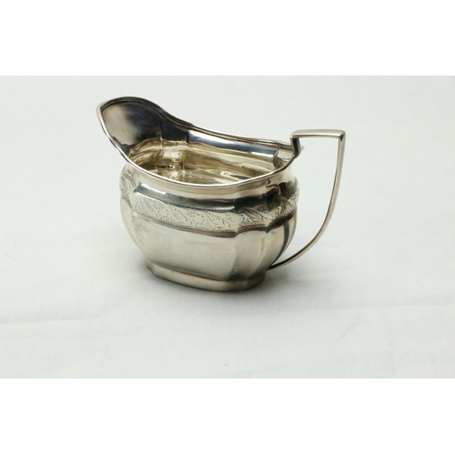 189 - A three piece silver bright cut Bachelors Tea Service, Sheffield 1900 / 1902, comprising oval teapot... 