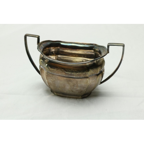 189 - A three piece silver bright cut Bachelors Tea Service, Sheffield 1900 / 1902, comprising oval teapot... 