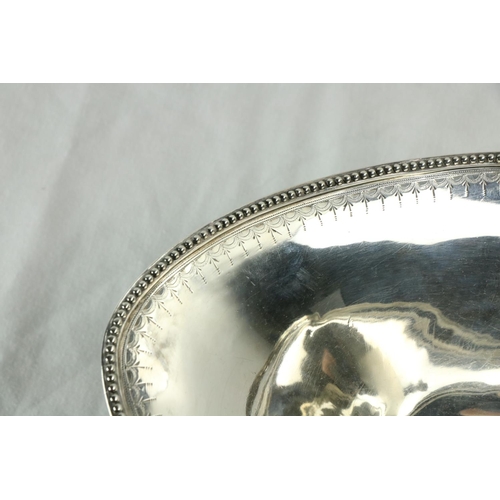 190 - A good English George III bright cut silver Fruit Basket, with swing handle and oval base, by Hester... 