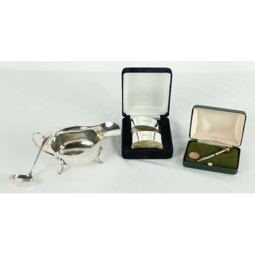 193 - A Sheffield silver Sauceboat, c. 1890, 111 grams; a Sheffield silver Sauce Ladle, 31 grams; a pair o... 