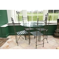 A modern heavy wrought iron Patio Suite, consisting of circular table with glass top, set of 4 match... 