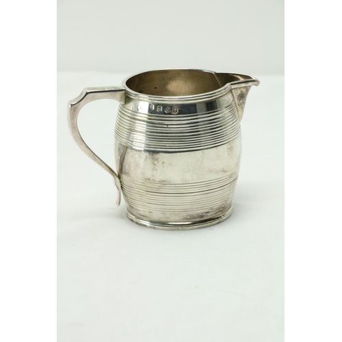 208 - A late George III Scottish silver Cream Jug, Edinburgh 1814, the barrel shaped body with a shaped ha... 