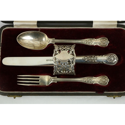 209 - A Victorian silver Set, knife, fork, spoon and napkin, London c. 1858, in original case with label o... 