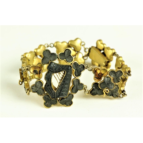 226 - A 19th Century bog oak Ladies Bracelet, decorated with shamrocks and central harp, together with a p... 