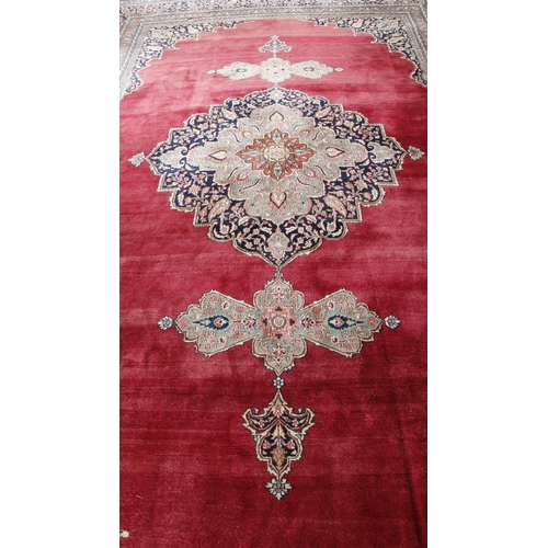 476 - A fine semi-antique burgundy ground Persian Carpet, the large centre medallion with stylized flowers... 