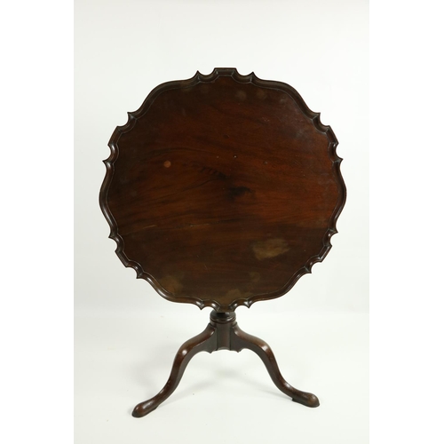 480 - A 19th Century mahogany flip top Table, with circular recurving pie-crust top on baluster pod and tr... 