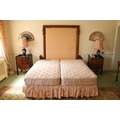 A modern 6' Divan Bed, with double mattress, and a padded carved pollard oak headboard, adapted. (1)... 