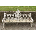 An important heavy pair of Victorian cast iron Garden Benches, each pierced back with a roundel... 