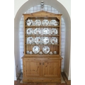 A good quality figured pine Dresser, the angled cornice over a four shelf open top, on a base with t... 