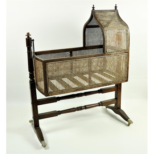 67 - A good 19th Century Gothic style mahogany Child's Rocking Cradle, with caned panels under an arched ... 