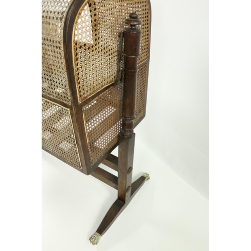 67 - A good 19th Century Gothic style mahogany Child's Rocking Cradle, with caned panels under an arched ... 