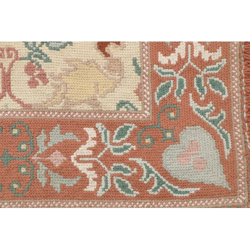 68 - A fawn ground Carpet, decorated with various animals and birds, inside one large border, approx. 356... 