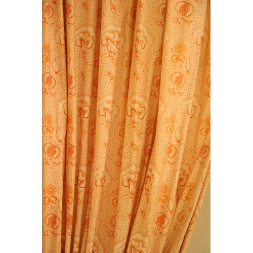 69 - Two pairs of lined salmon coloured Curtains, 274cms drop x 183cms wide (9' x 6'), with attractive dr... 