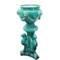 A pair of very large turquoise coloured glazed porcelain matching Urns and Stands, the urns with fiv... 