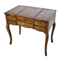An early 19th Century French walnut and marquetry Coiffeuse, (Dressing Table), with centre pop up mi... 