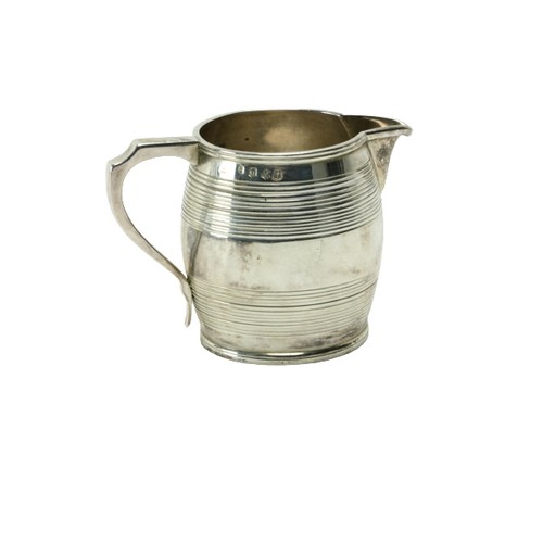 208 - A late George III Scottish silver Cream Jug, Edinburgh 1814, the barrel shaped body with a shaped ha... 