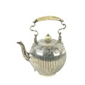A Victorian silver half fluted Tea Kettle, of bulbous form with ivory handle and finial chased with ... 