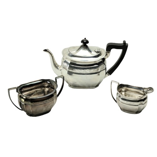 189 - A three piece silver bright cut Bachelors Tea Service, Sheffield 1900 / 1902, comprising oval teapot... 