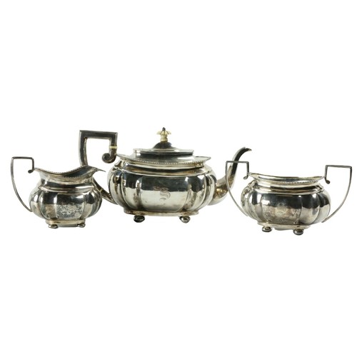 180 - A three piece silver Tea Service, Chester c. 1900, comprising ogee shaped teapot with gadroon edge o... 