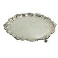 A large silver Salver, by Hemming & Co. Ltd., London 1912, with scroll and scallop edge and rais... 