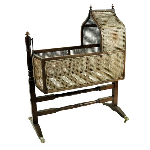 67 - A good 19th Century Gothic style mahogany Child's Rocking Cradle, with caned panels under an arched ... 