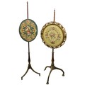 Two - 19th Century mahogany Polescreens, one with oval tapestry panel, the other with a circular pan... 