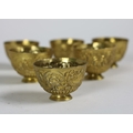 A very unusual set of 6 gilt metal stemmed Bowls or Cups, each in the rococo style with scrolls and ... 