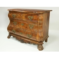 An 18th Century Dutch walnut bombe shaped Commode, the shaped figured top with moulded edge, over tw... 